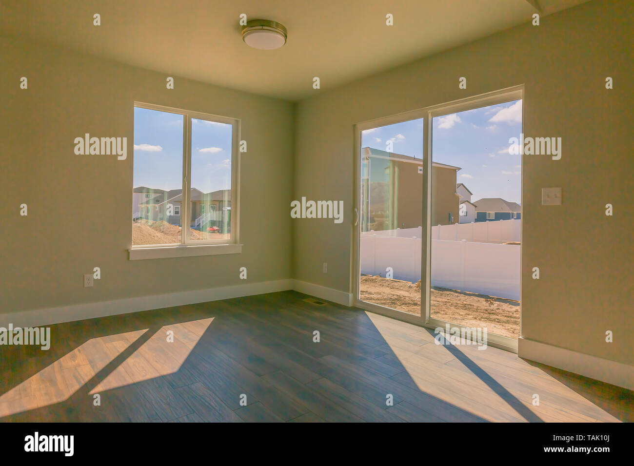 Epmty Room Of A New House With Beige Wall Paint And Glossy