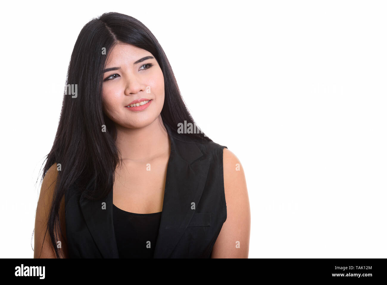 Studio Portrait Of Young Happy Asian Woman Thinking Stock Photo - Alamy