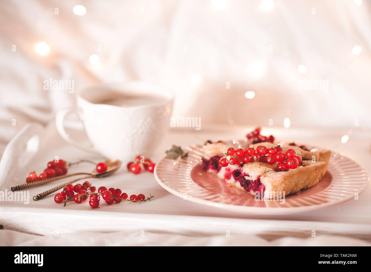 Cup of coffee with fruit cake on white tray closeup. Good morning. Stock Photo