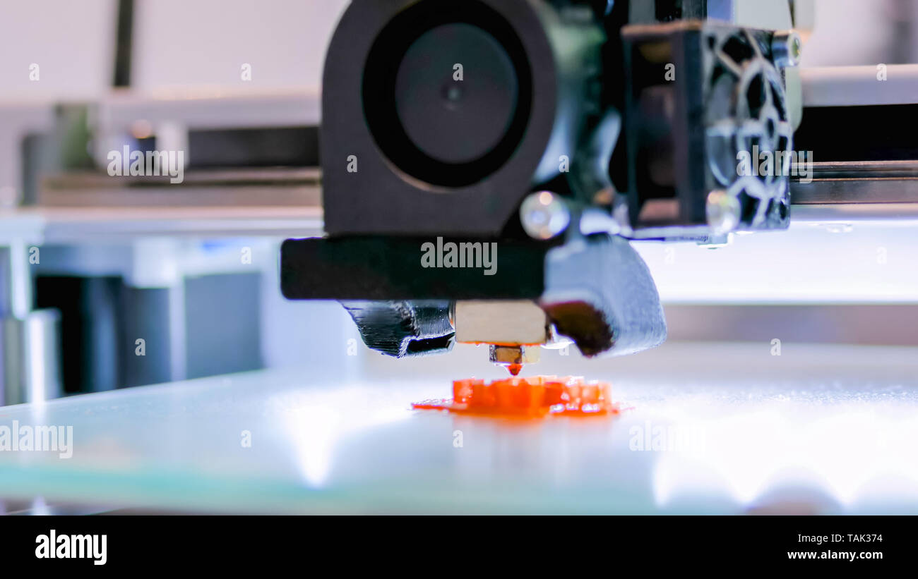 Modern 3D printer machine printing plastic model Stock Photo