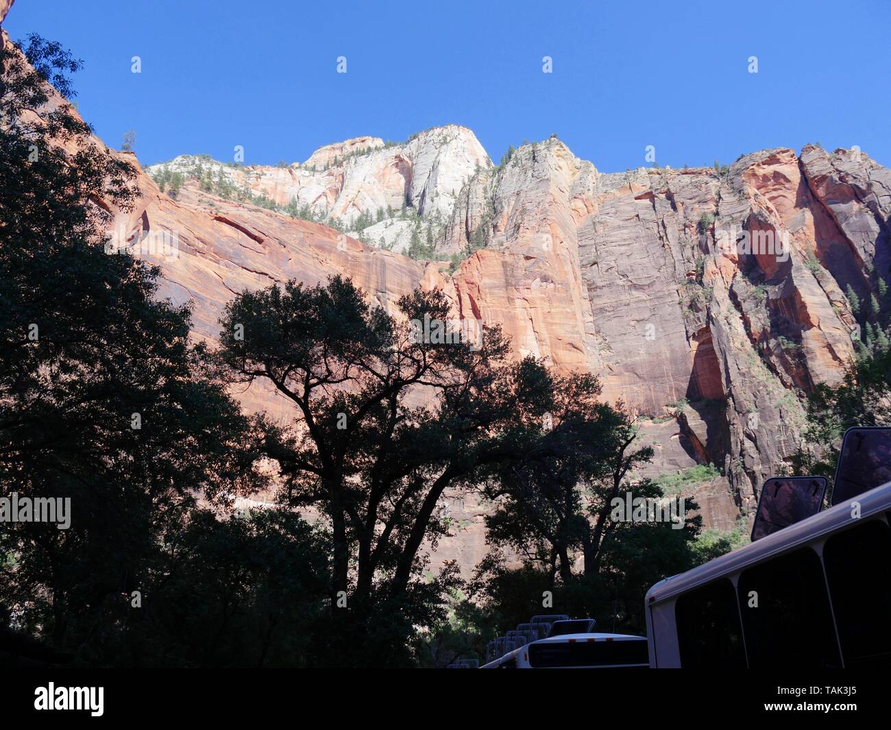 Imposing red rock walls of a steep cliff at Zion National Park, Utah ...