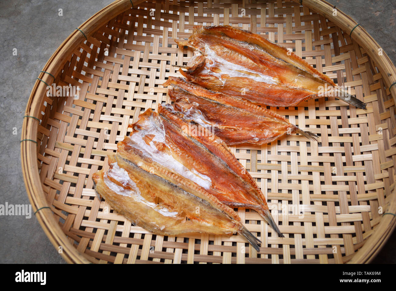 Making dried fish / dry salted fish on threshing basket background Stock  Photo - Alamy