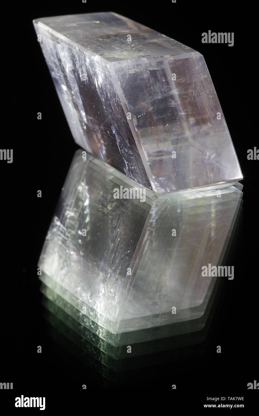 Icelandic Spar Calcite Crystal on a Shiny Black Background. Macro