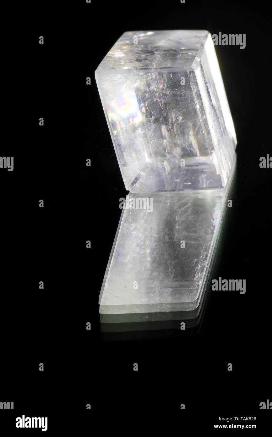 Icelandic Spar Calcite Crystal on a Shiny Black Background. Macro