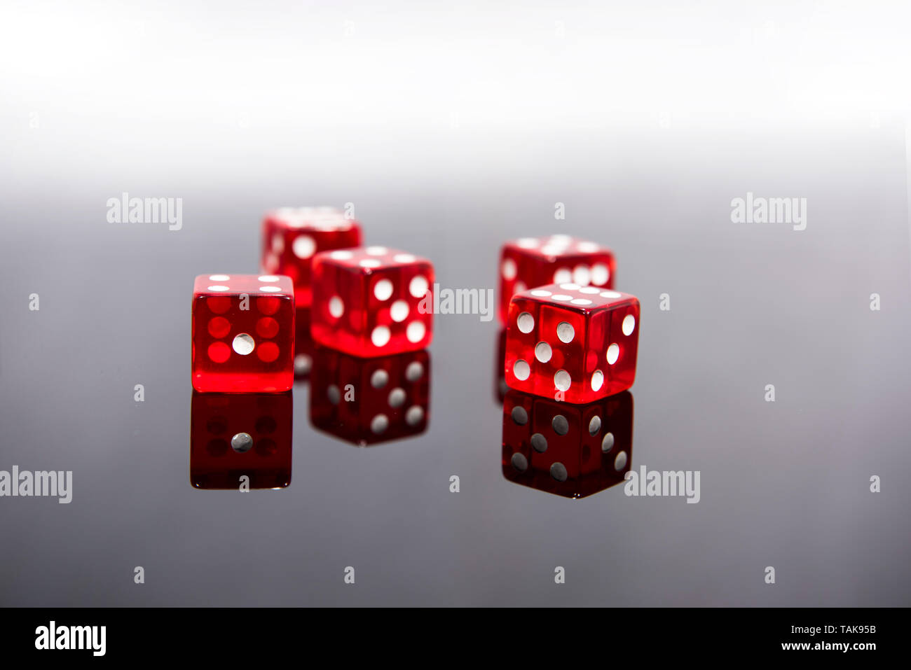 Red dice on transparent black background Stock Photo