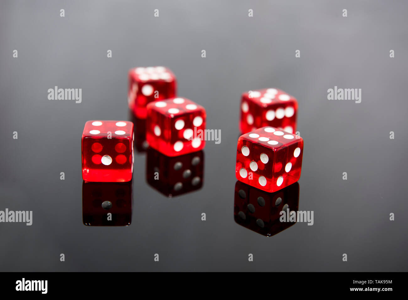Red dice on transparent black background Stock Photo