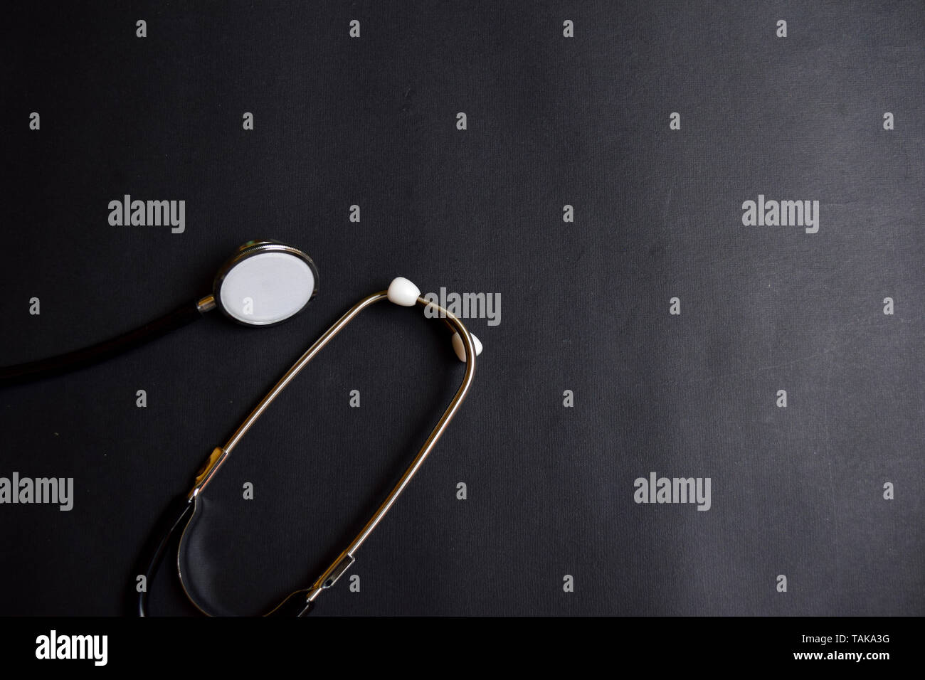 Black stethoscope. Healthcare isolated black background Stock Photo - Alamy