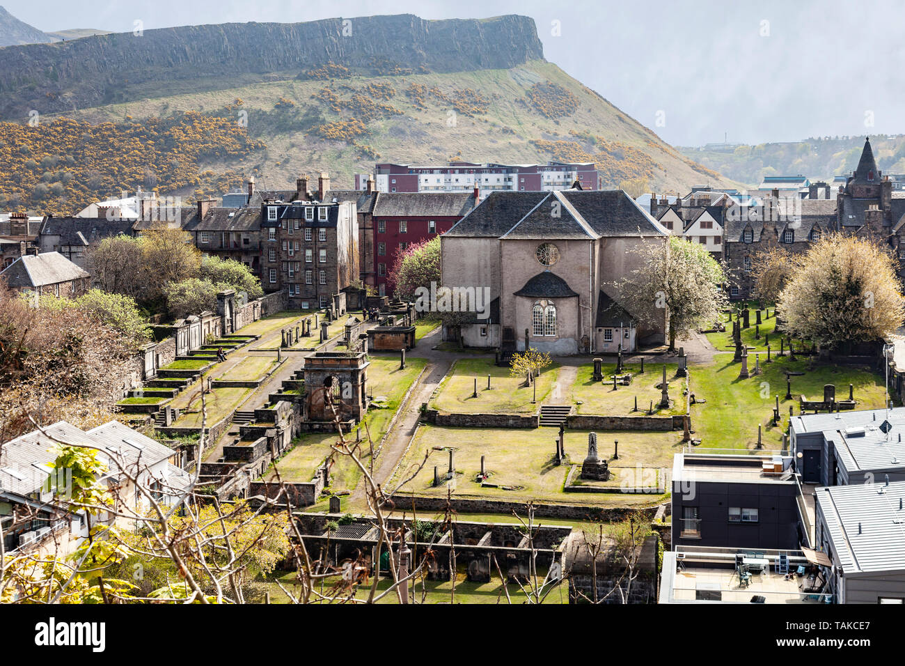 Elevated view over the Old Town of Edinburgh, featuring the 17th Century Canongate Kirk and Kirkyard, in which luminaries including the poet Robert Fe Stock Photo