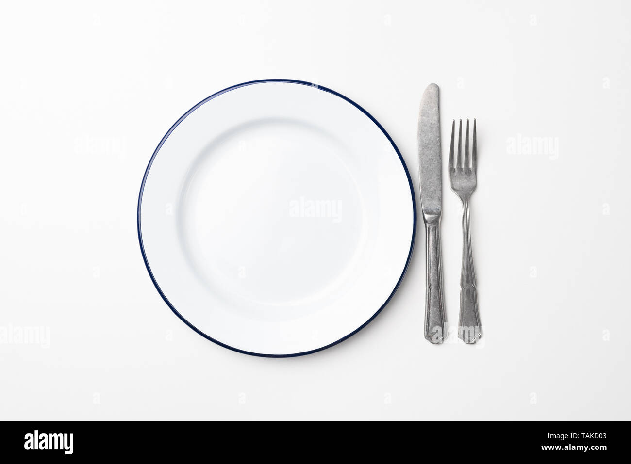 Empty plate and cutlery on white background, top view. Table setting ...