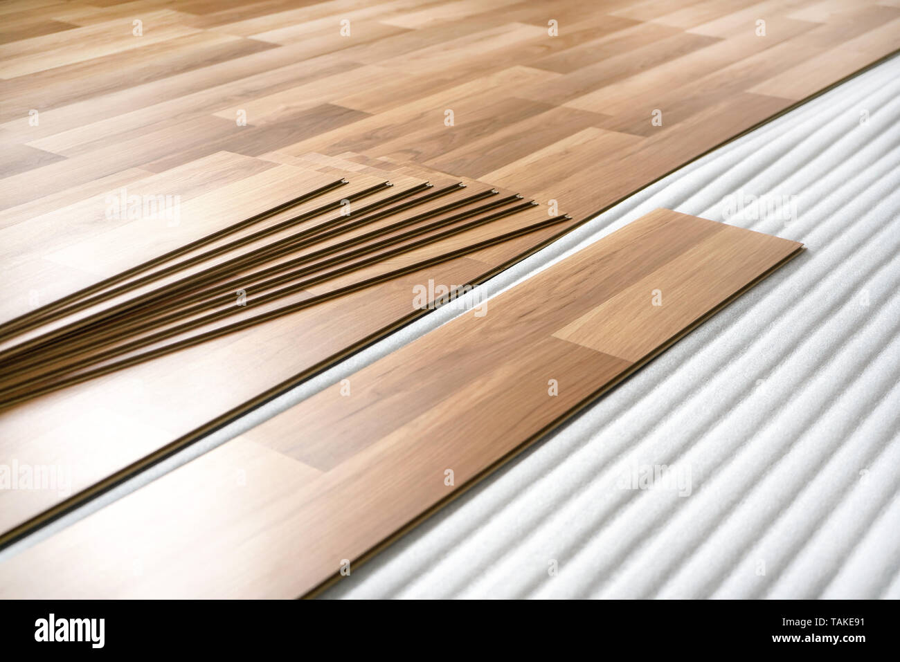 Wooden Tiles Ready To Be Put Down As Laminated Floor On Base Foam