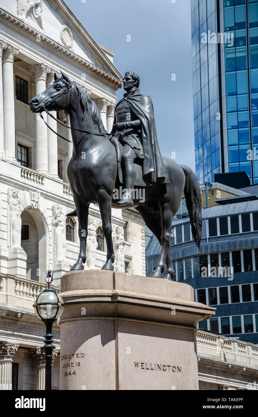 The Equestrian statue of the Duke of Wellington seen in front the The Bank of England in The City of London. Stock Photo