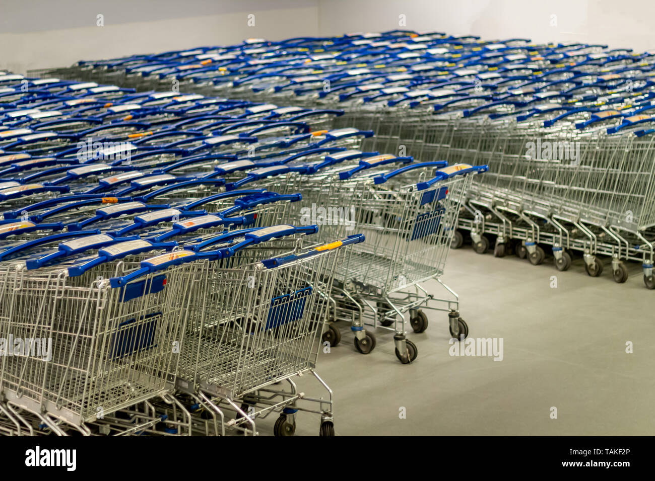 Supermarket shopping carts lined up empty Stock Photo