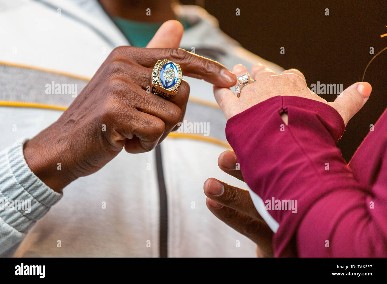 May 25, 2019 - Napa, California, U.S - NFL wide receiver JERRY RICE  compares his Hall of Fame ring to TRISHA YEARWOOD's wedding ring during the  BottleRock Music Festival in Napa, California (