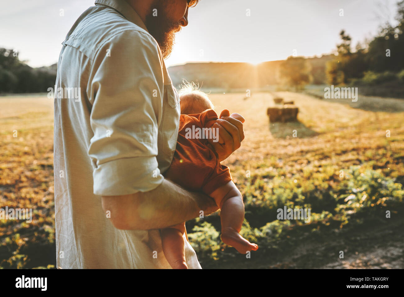 Father walking with baby child family lifestyle travel vacations together parent love Fathers day Stock Photo