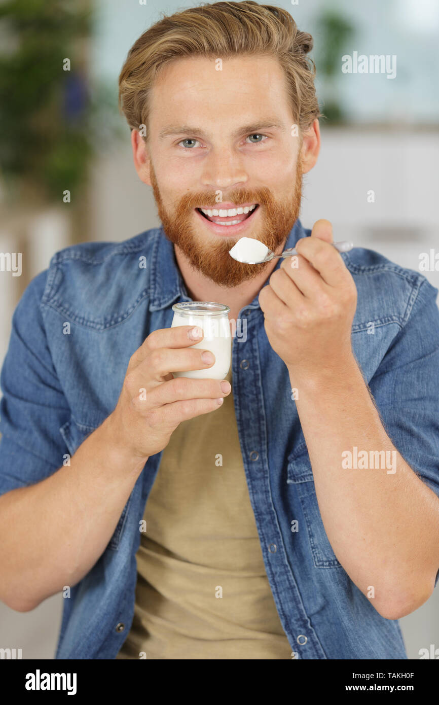 happy-man-is-eating-yogurt-stock-photo-alamy