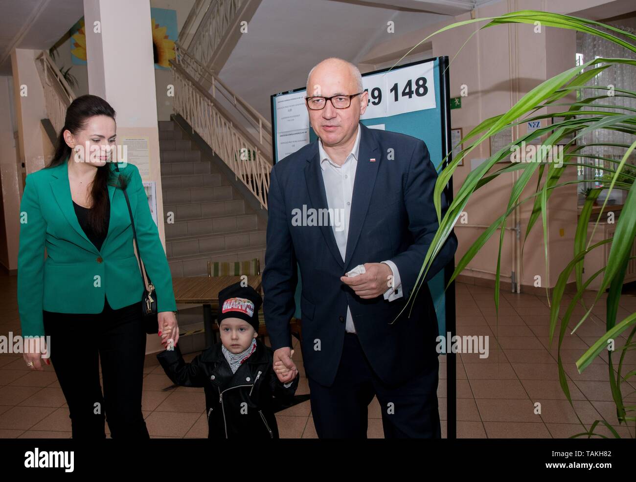 Poland's minister of the Interiour Joachim Brudzinski and his wife Arletta Brudzinska  vote for the European Parliament election at a polling station Stock Photo