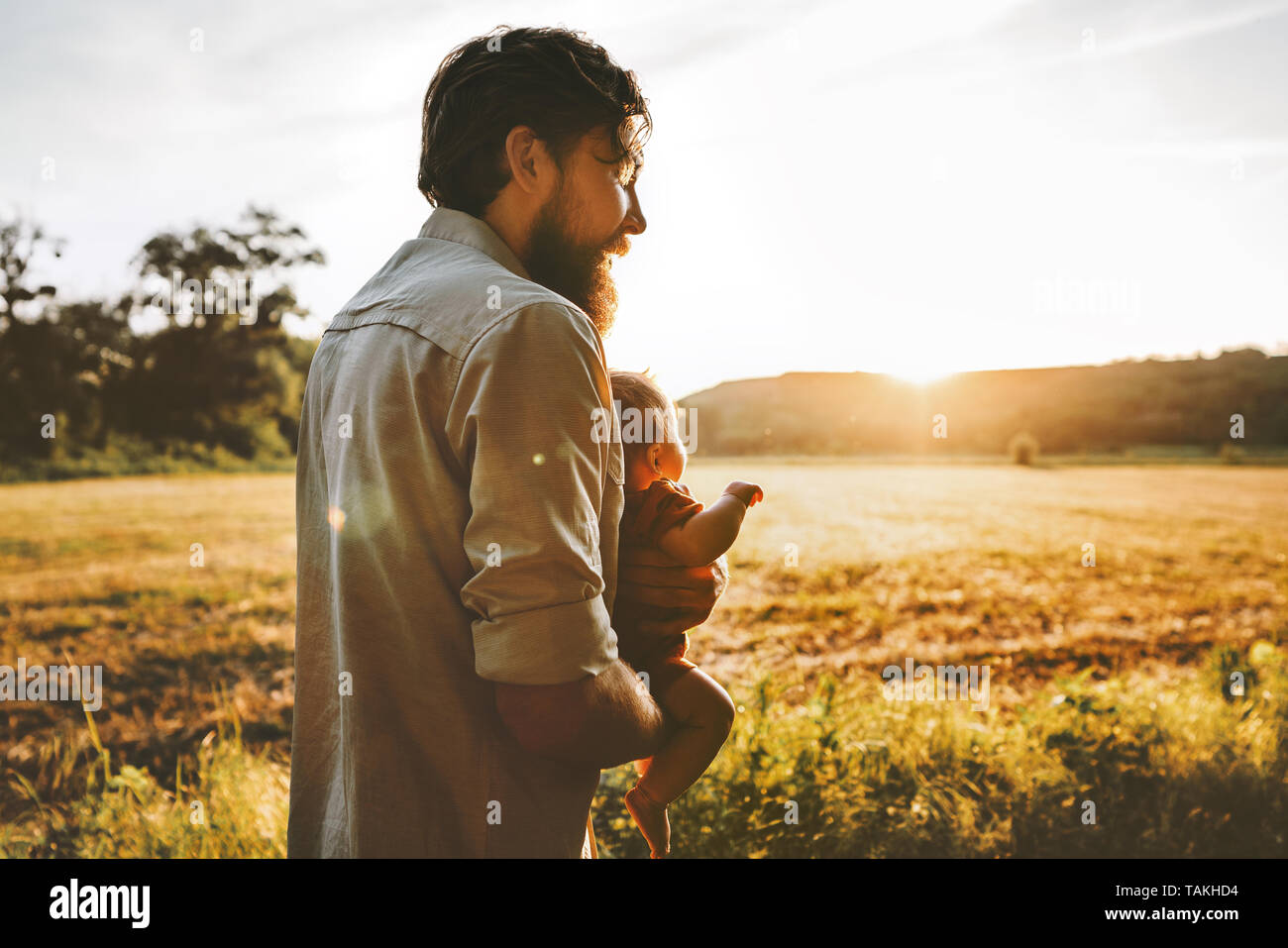 Father and baby walking together outdoor family lifestyle dad traveling with child parenthood