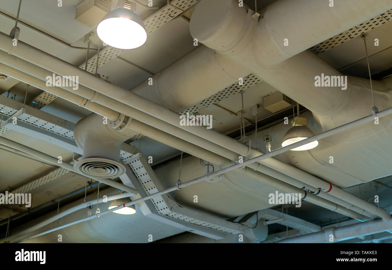 Air duct, wiring and plumbing in the mall. Air conditioner pipe, wiring
