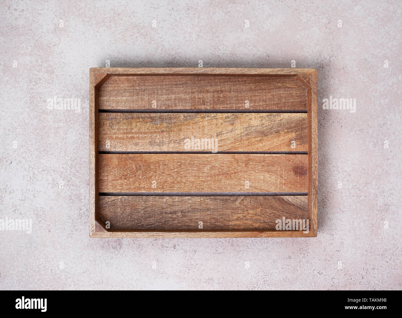 empty wooden box on concrete background. view from above. copy space Stock Photo