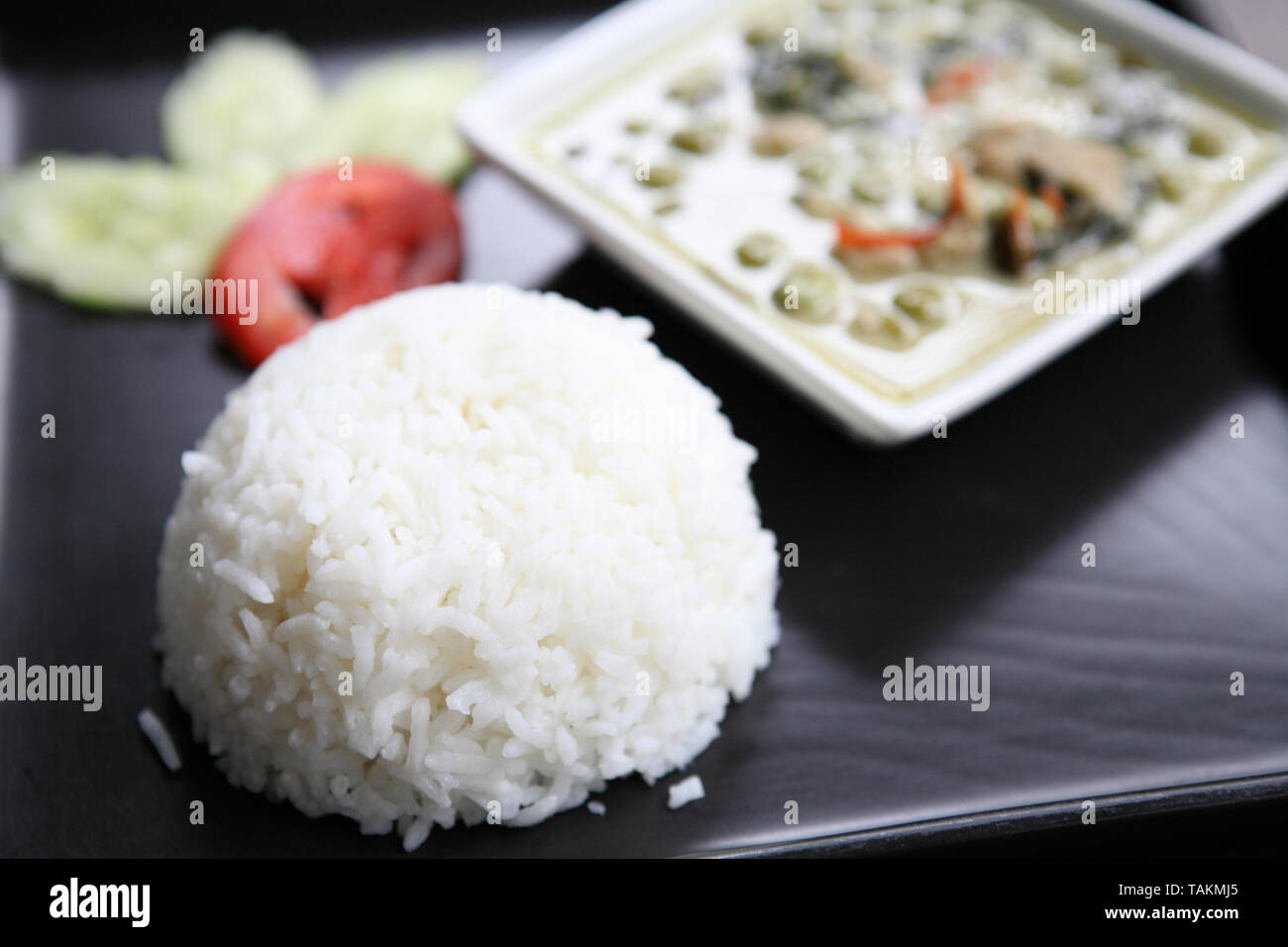 Thai food chicken green curry with rice in wood background Stock Photo ...