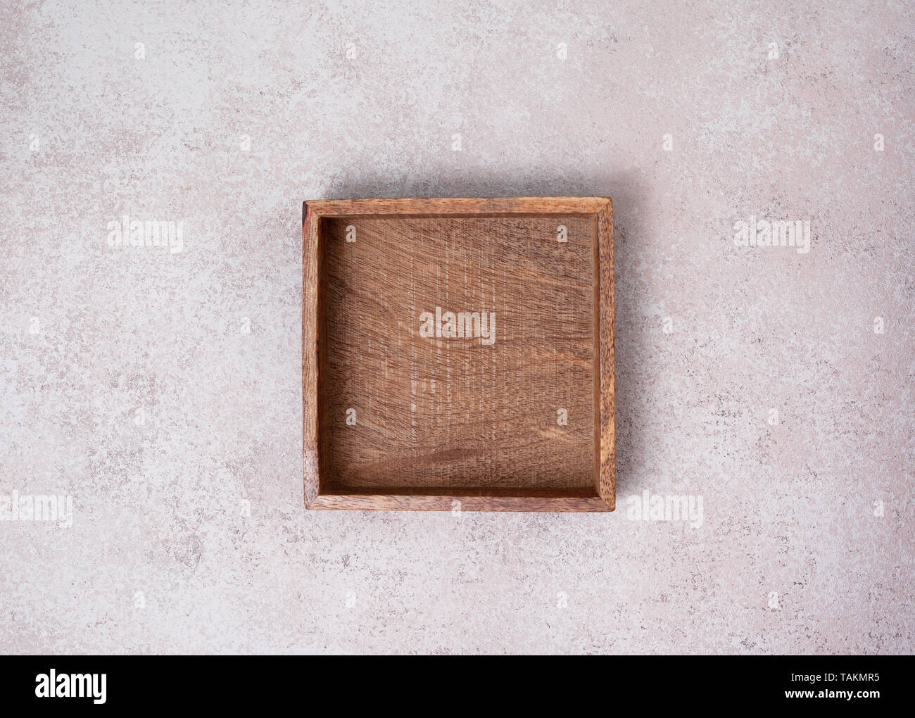 empty wooden box on concrete background. view from above. copy space Stock Photo