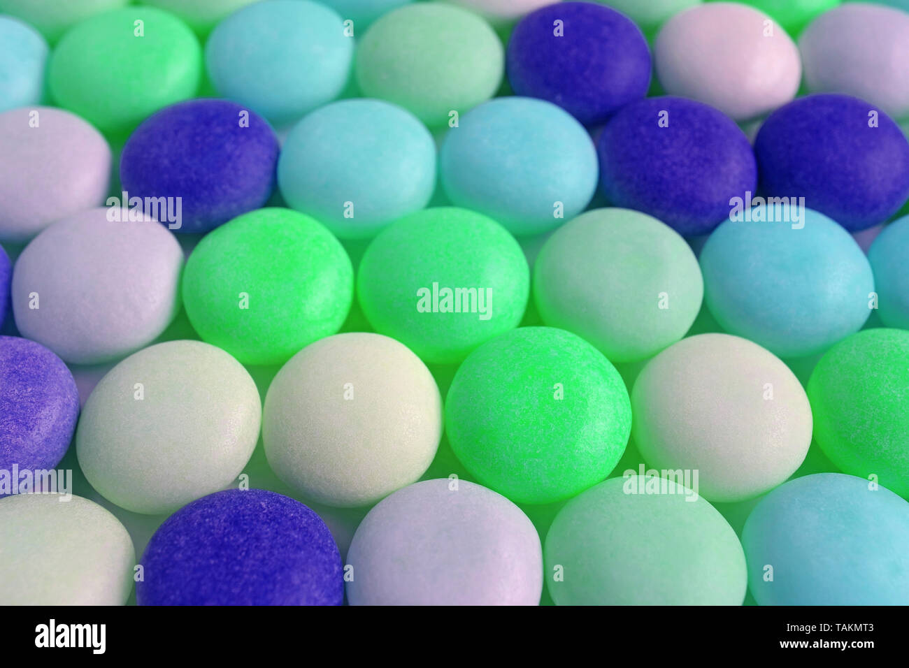 Row of Bright Green and Blue Colored Round Shaped Candies Stock Photo ...