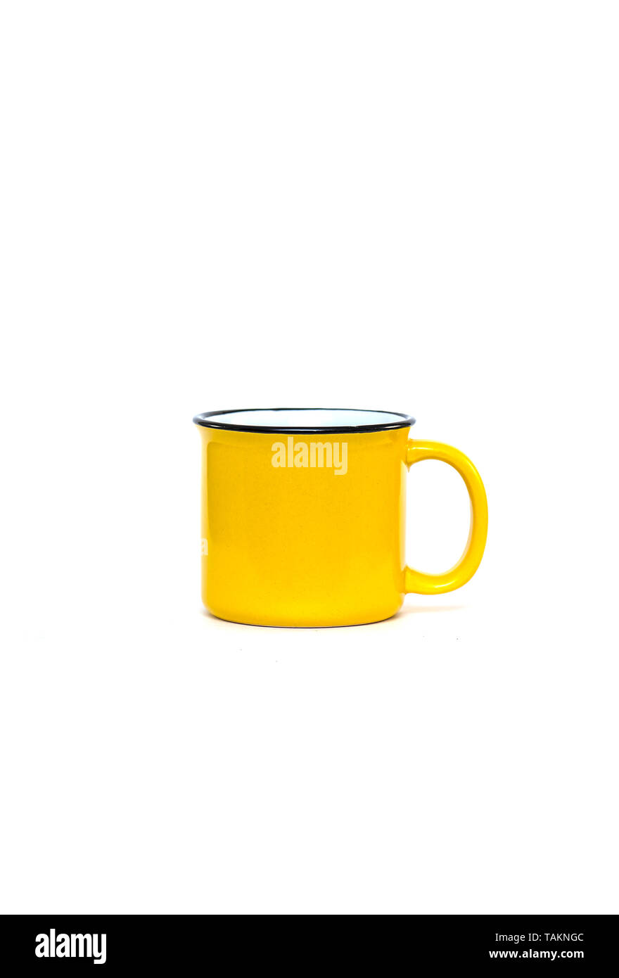 Yellow ceramic Mug isolated on white Background Stock Photo