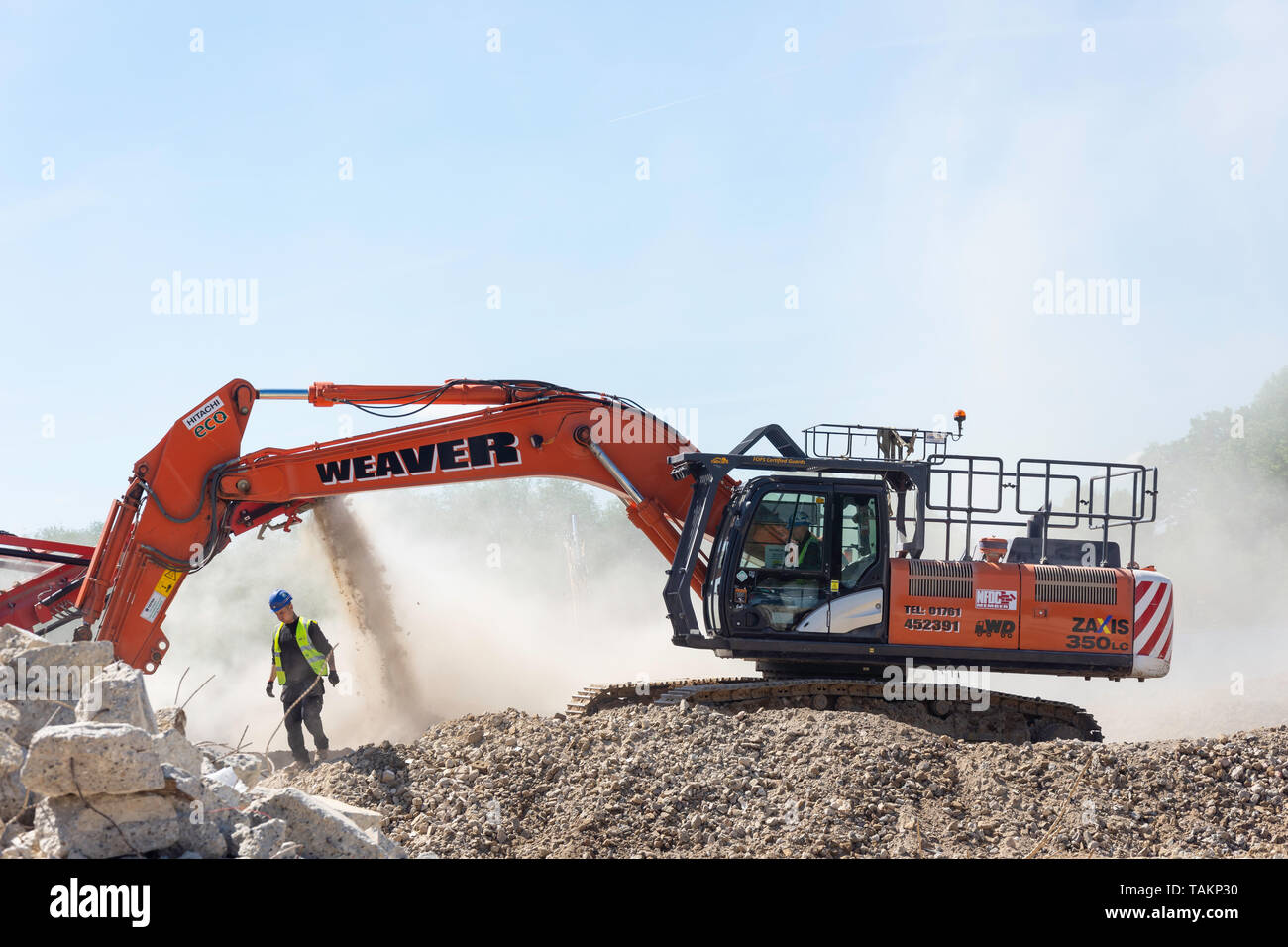 Hitachi Zaxis 350LC-6 Excavator moving rubble, Egham, Surrey, England, United Kingdom Stock Photo