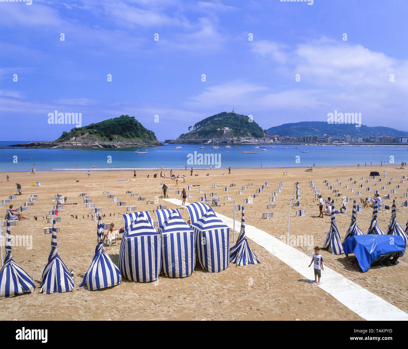 Traditional beach tents on La Concha Beach, Bahia de La Concha, San Sebastian (Donostia), Basque Country (Pais Vasco), Spain Stock Photo