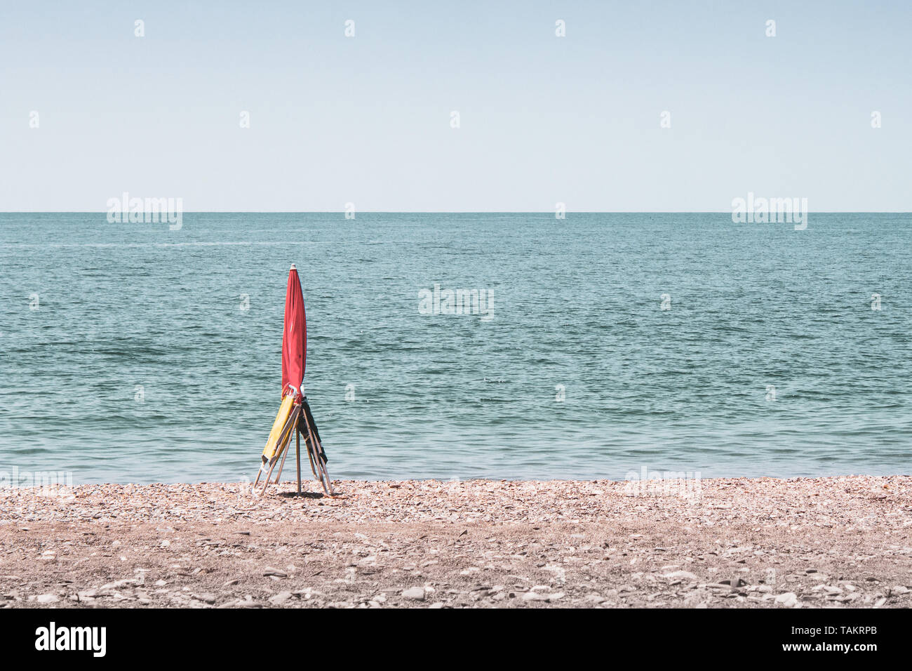 Umbrella and two chairs booking the spot on the beach in Málaga Andalucía Spain Stock Photo