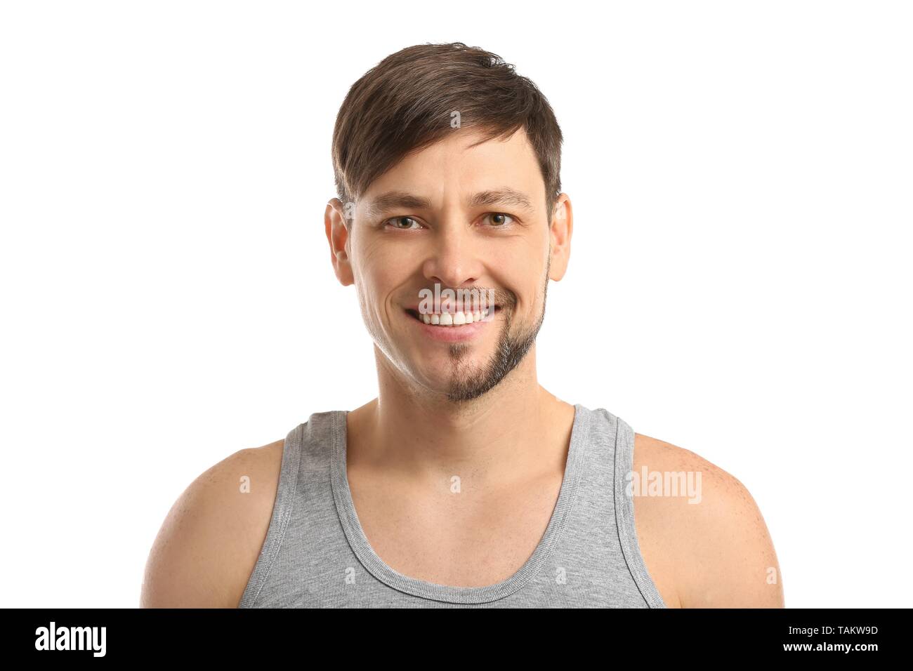 Handsome man having half of his face shaved against white background Stock Photo