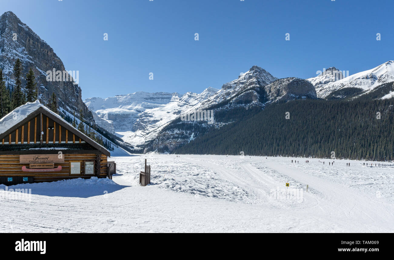 Lake Louise, CANADA - MARCH 20, 2019: frozen lake and mountains with ...