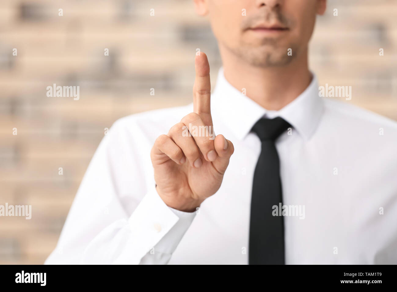 Businessman man raised index finger hi-res stock photography and images ...