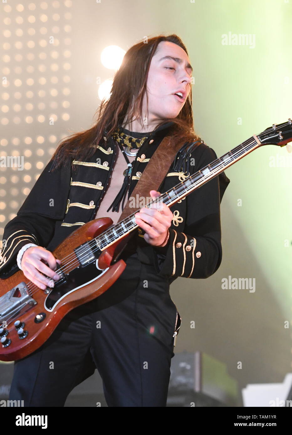 Guitarist Jake Kiszka is shown performing stage during a "live" concert