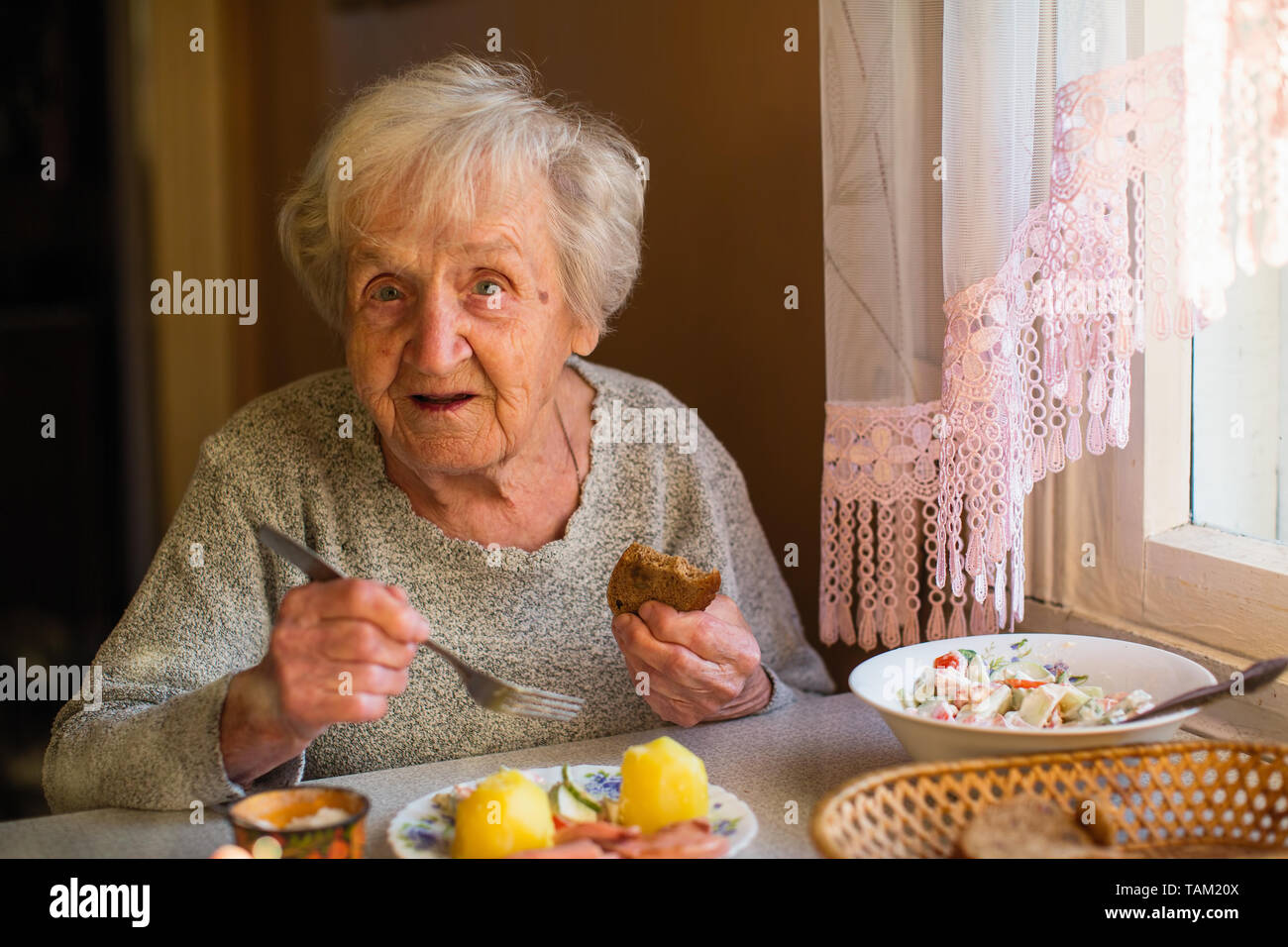 Portrait old woman eats hi-res stock photography and images - Alamy