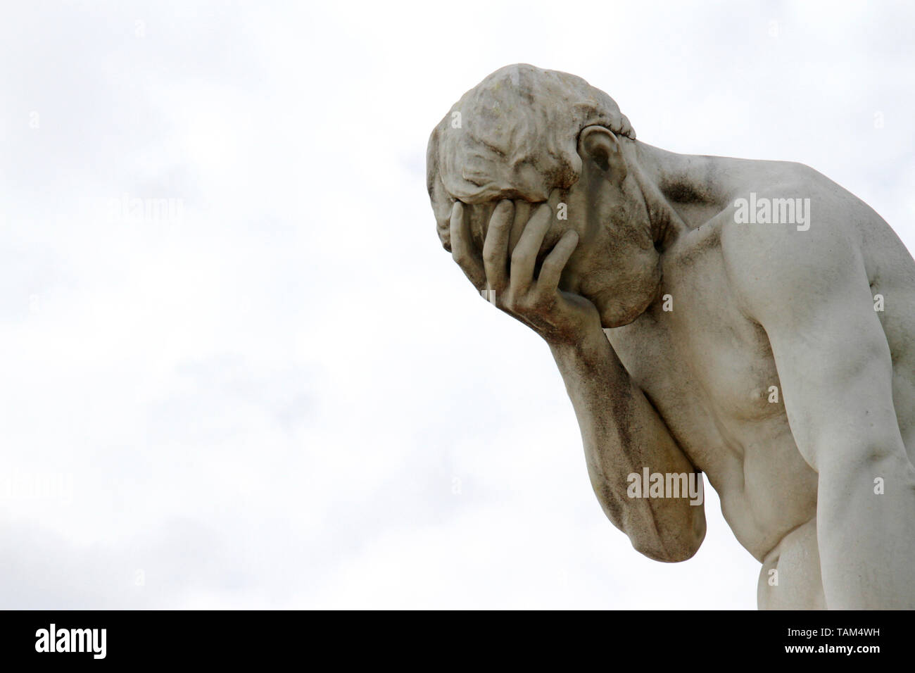 Facepalm - ashamed, sad, depressed. Statue with head in hand Stock Photo -  Alamy