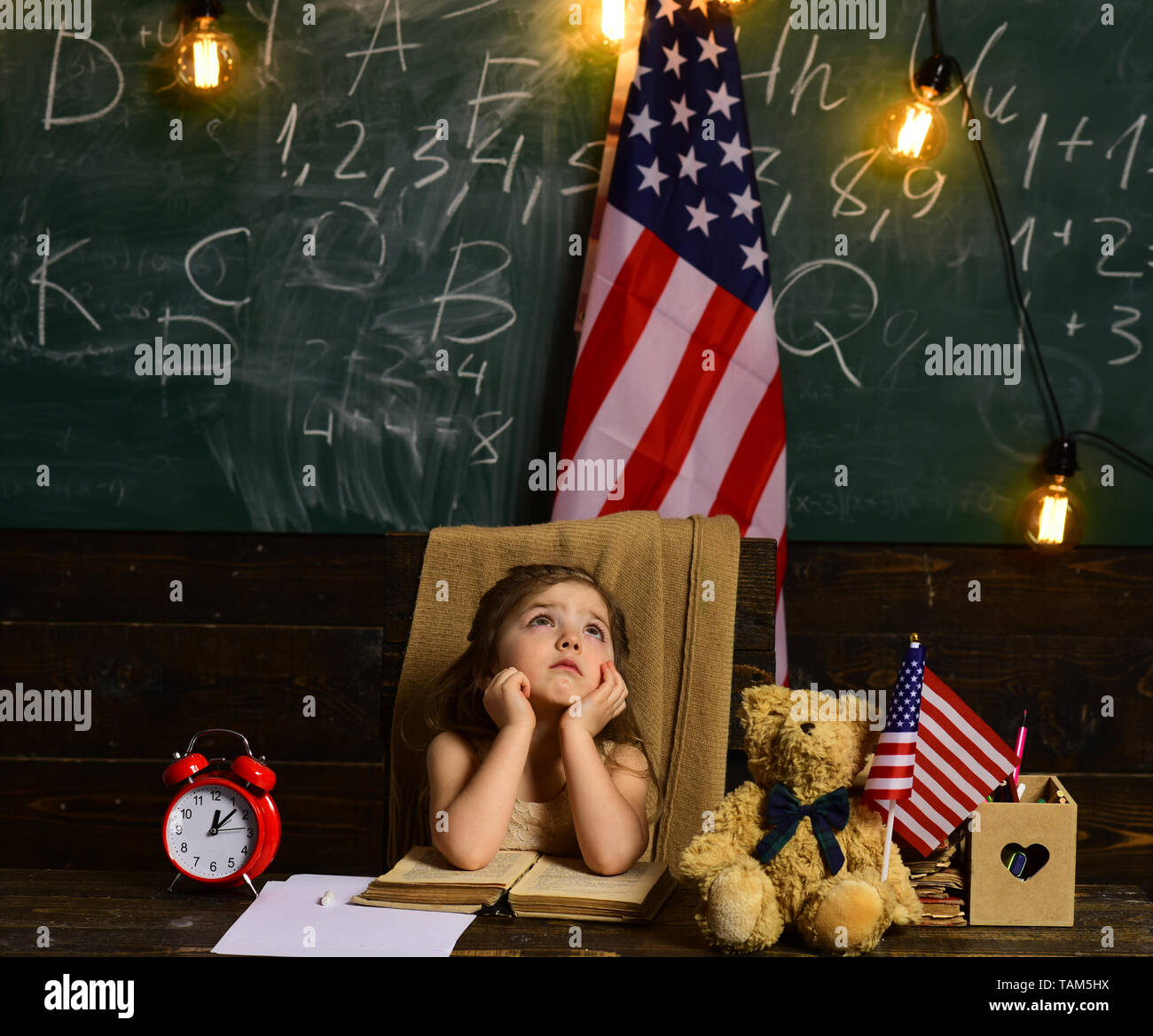 Tutor he must also have the parents trust. US flag and a blackboard. Little help can get student back on track. Education university and school system Stock Photo