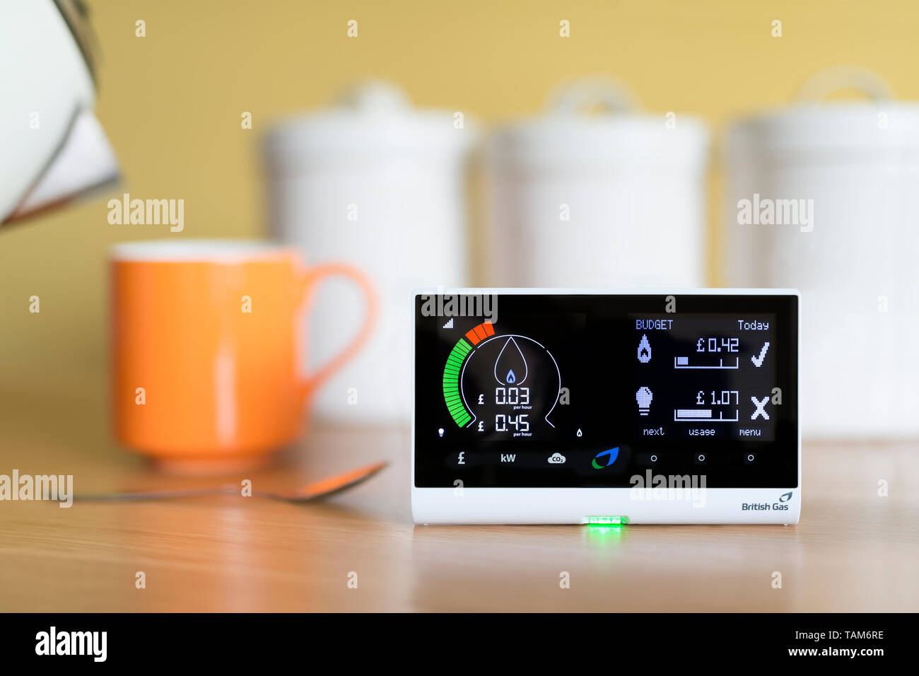 A domestic use British Gas energy smart meter displaying the cost of gas electricity usage in a UK home, placed in a kitchen environment. Stock Photo