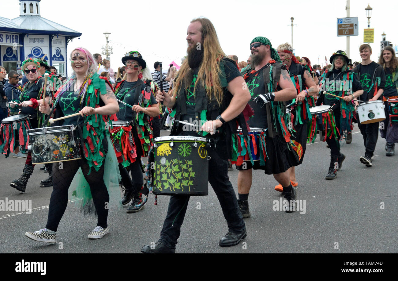The Pentacle Drummers marching along the seafront at Eastbourne Sunshine Carnival, Sussex, England, UK. May Bank Holiday 2019 Stock Photo