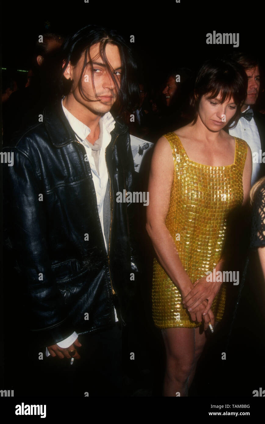 Hollywood, California, USA 4th May 1994 Actor Johnny Depp and actress Ellen  Barkin attend 'APLA Fashion Show Honoring Isaac MIzrahi' on May 4, 1994 at  Mann's Chinese Theatre in Hollywood, California, USA.