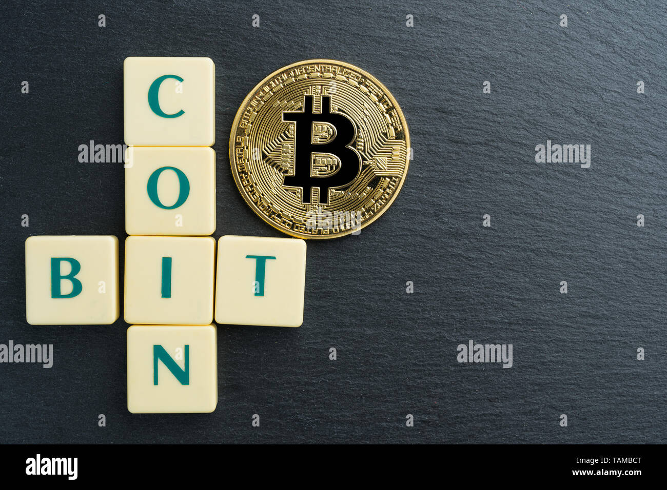 A gold bitcoin with the letter B on it. The coin is shiny and has a  reflective surface Stock Photo - Alamy