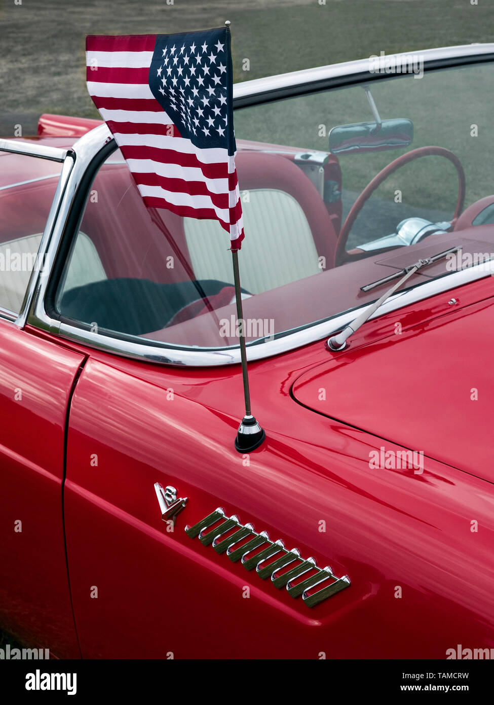 1955 Ford Thubderbird flying the stars ans stripes flag Stock Photo