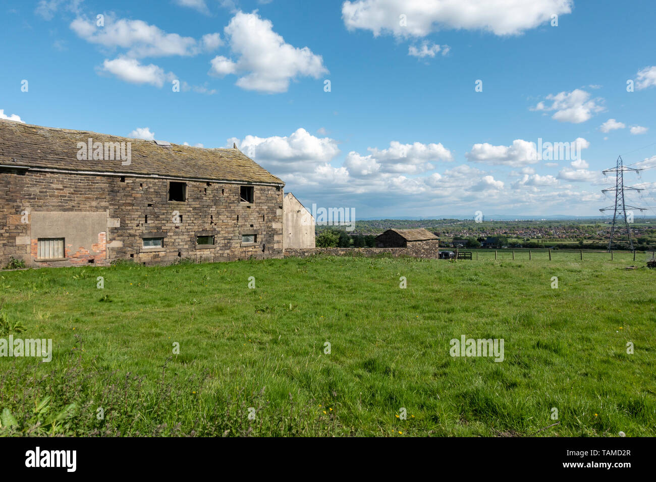 Old Farm Barn now converted into houses in Bolton Stock Photo