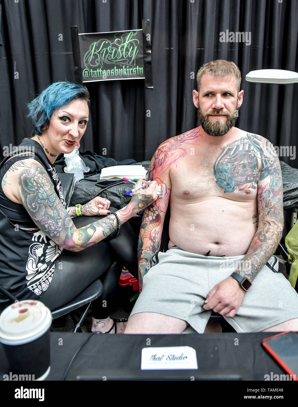 London, UK. 26th May, 2019. Kristy Peake, tattoo a client at The Great British Tattoo Show, on 26 May 2019, London, UK. Credit: Picture Capital/Alamy Live News Stock Photo