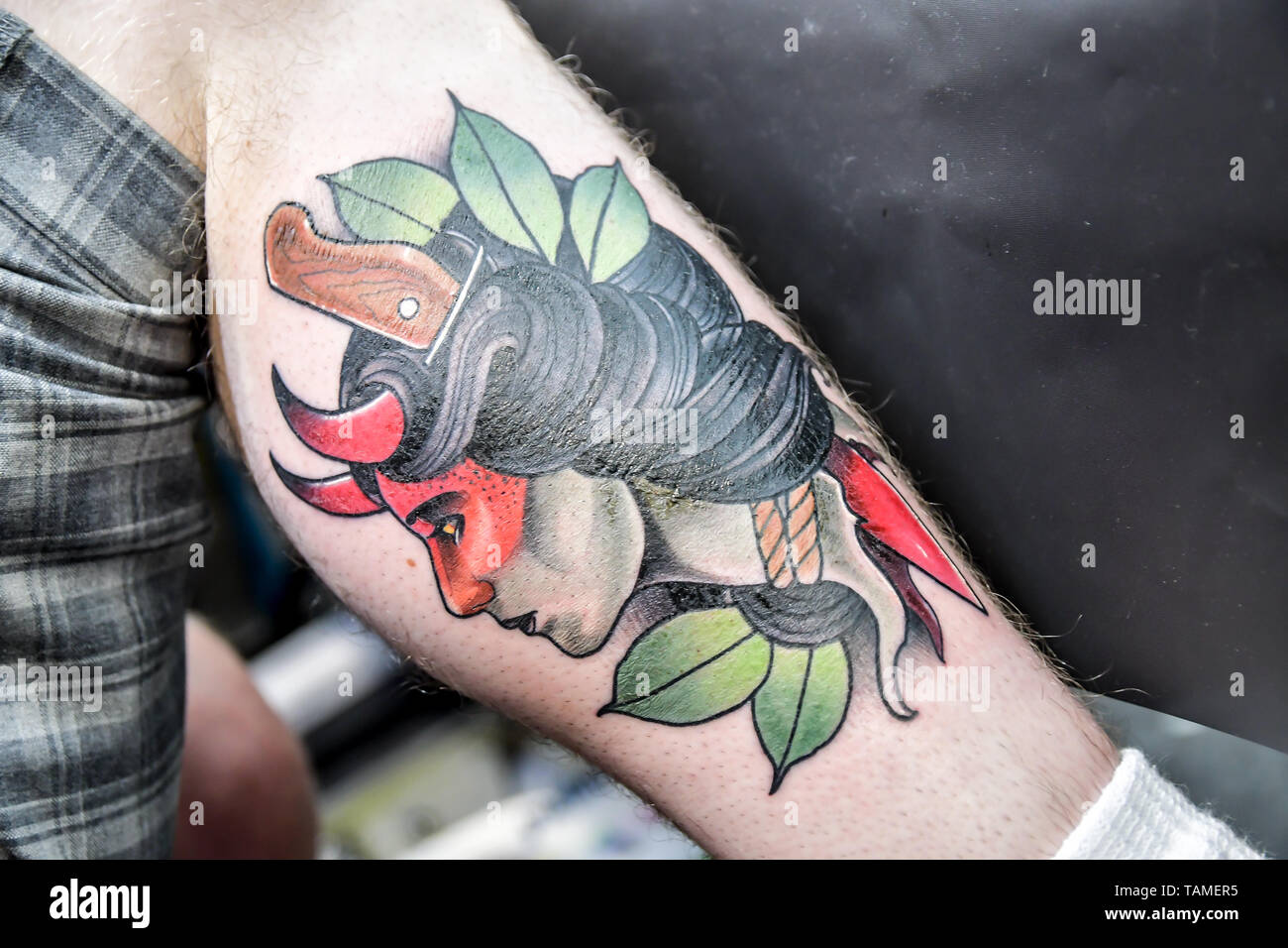 London, UK. 26th May, 2019. Matt Edwards TattooER, Tattoo a client at The Great British Tattoo Show, on 26 May 2019, London, UK. Credit: Picture Capital/Alamy Live News Stock Photo