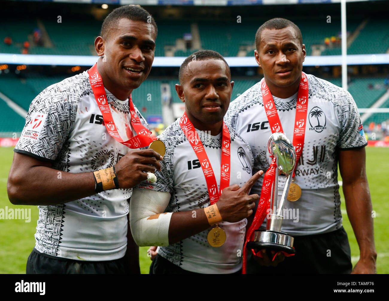 London, UK. 26th May, 2019.  L-R Aminiasi Tuimaba, Waisea Nacuqu and Paula Mocenacagi of Fiji with Trophy during The HSBC World Rugby Sevens Series 2019 London 7s Final  between Fiji and Australia at Twickenham on 26 May 2019 Credit: Action Foto Sport/Alamy Live News Stock Photo