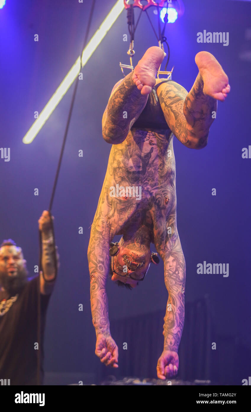 Groningen, Netherlands. 26th May, 2019.  Emilio Gonzalez  doing an elevation at the Ink&Kutz Tattoo and Live Style, Rolf Buchholz, from Dortmund, Germany special guest ,hanging from hooks in his lower back Credit: Paul Quezada-Neiman/Alamy Live News Stock Photo