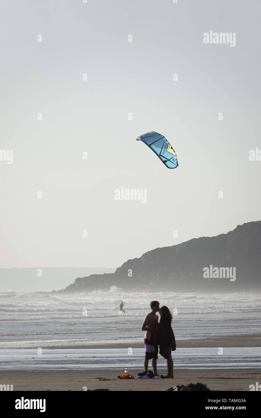 Gower, Swansea, Wales, UK. 26th May 2019. Weather: After a cool, damp and cloudy start beachgoers enjoyed a much brighter afternoon at Llangennith beach on the Gower peninsula, near Swansea, South Wales, with spells of warm sunshine despite the westerly breeze. Scattered showers are expected to return to some areas in the coming days but more southerly areas may remain dry. Credit: Gareth Llewelyn/Alamy Live News Stock Photo