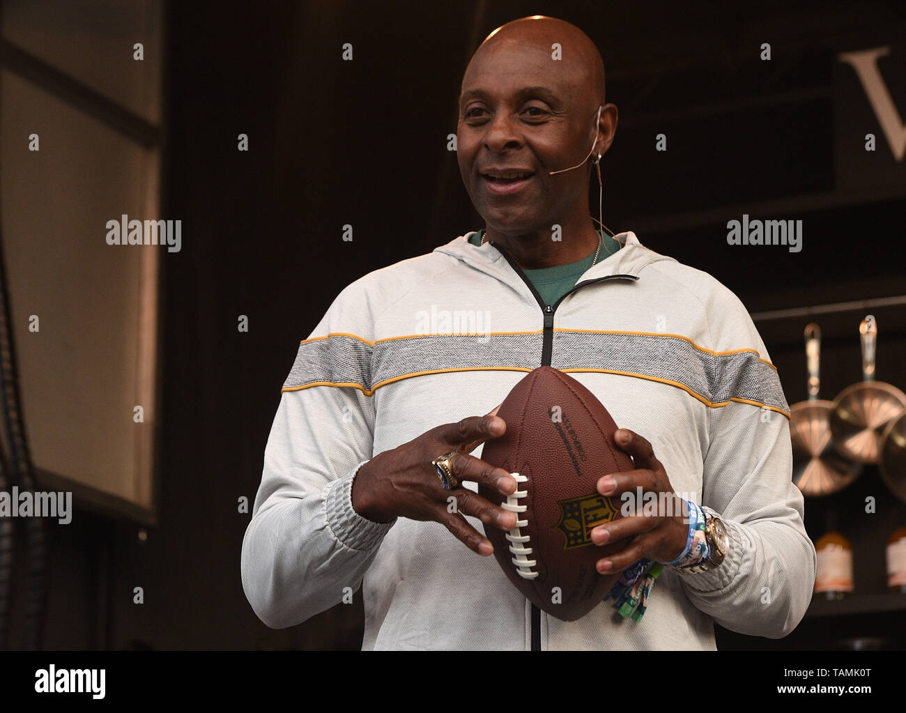 May 25, 2019 - Napa, California, U.S - NFL wide receiver JERRY RICE  compares his Hall of Fame ring to TRISHA YEARWOOD's wedding ring during the  BottleRock Music Festival in Napa, California (