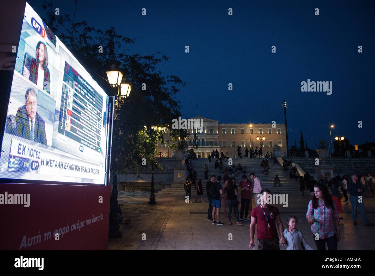 A huge screen seen infront of the Greek Parliament at an electoral kiosk during the first results of exit poll in the centre of Athens. Stock Photo